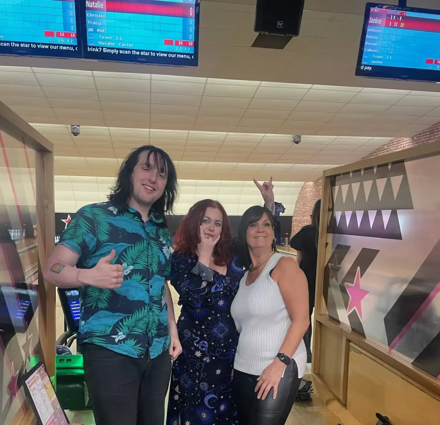 People standing in bowling alley